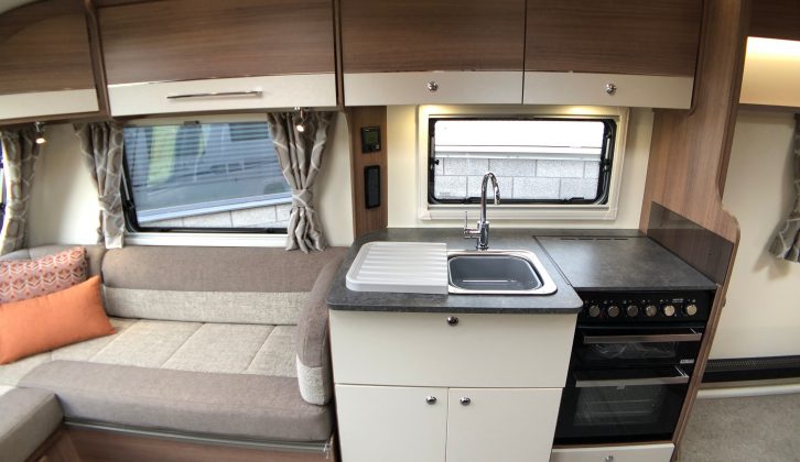 The midships kitchen in the new Bailey Pegasus Grande Brindisi has a dual-fuel cooker. separate oven and grill, a pair of plug sockets and plenty of storage