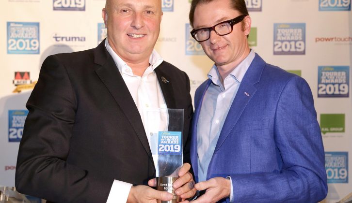 Nick Page from Swift Group collects the award for Best Luxury Tourer for the Swift Elegance Grande 635, at Practical Caravan's Tourer of the Year Awards 2019