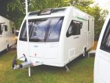 This season, the Quasar's exterior has a distinctive green stripe on the decals, differentiating it from other caravans at this price point