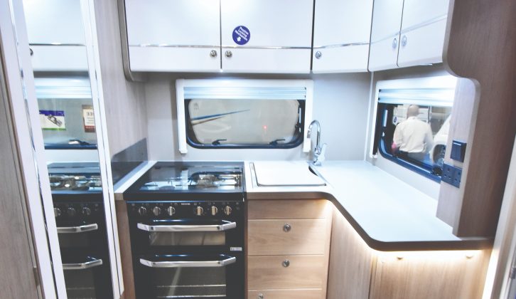 The kitchen has acres of worktop and storage, and excellent lighting