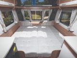 Pull out the bed frames to create an enormous sleeping area right across the caravan