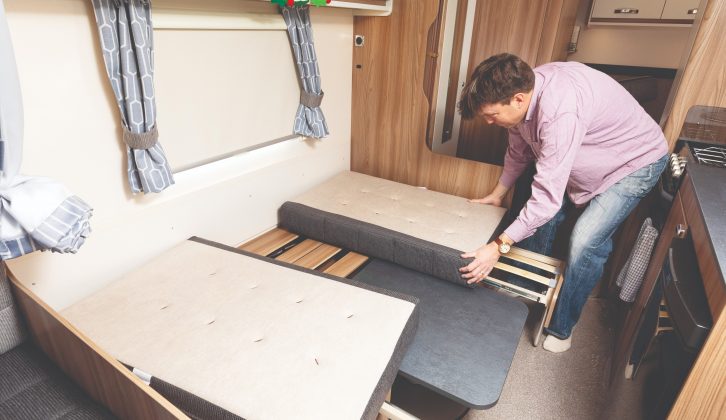 The double bed in the dinette is a bit complicated to piece together, and the partition curtain only just contains it