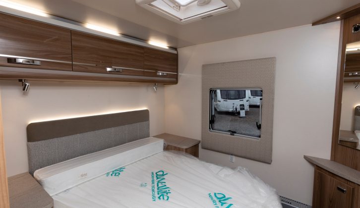 The larger headboard for the rear island bed is also illuminated in this Dealer Special. There's also a second TV point and lots of storage space, including under the bed