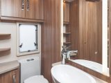 The washroom has a huge mirror and plenty of storage space, plus a roomy shower cubicle, although there's no roof vent
