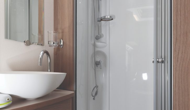 Washrooms aren't always this stylish... the fully lined shower cubicle has a chrome upriser and bi-fold doors make access easy