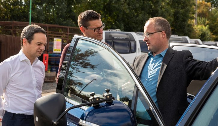 Hyundai's Jamie Woods shows tester Sam around the car before his test drive