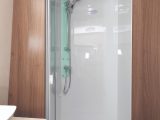The shower cubicle is large, with a handy towel ring just outside