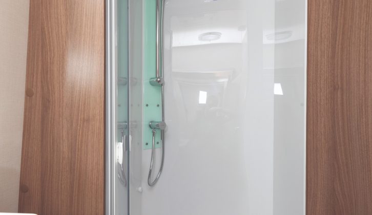 The shower cubicle is large, with a handy towel ring just outside