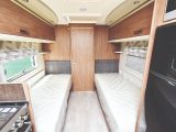 Single beds are placed at a sensible height, with comfortable mattresses and storage underneath