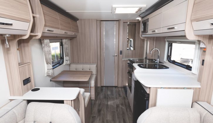 Facing the rear of the caravan, with the dinette creating an occasional bed and the washroom beyond the panelled door