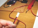 Check polarity (see panel back cover), then slot socket terminals into Latch Housing