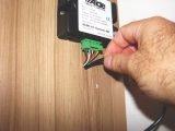 Feed the Latch Housing through the internal panel, then connect it to the control panel