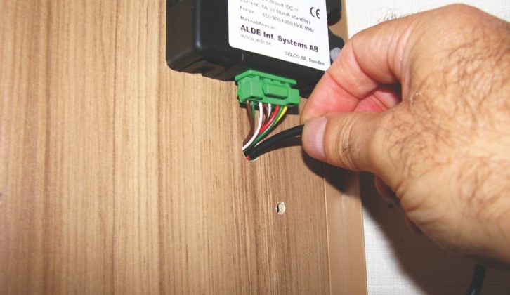 Feed the Latch Housing through the internal panel, then connect it to the control panel
