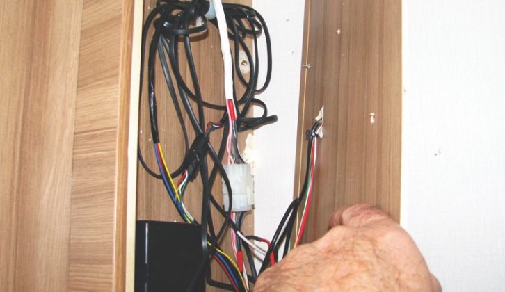 Remove the internal panel from the locker to access the wiring