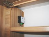 The Alde Smart Control unit inside an overhead locker