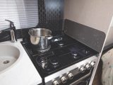 The kitchen boasts a four-burner hob so you can use either gas or electric