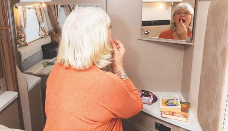 The bedroom mirror is set at a sensible height