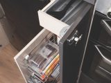 Storage includes a cutlery drawer and a small cupboard