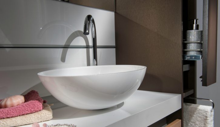 Stylish touches abound, such as this smart basin in the washroom