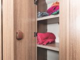 This very sizeable shelved cupboard is within the washroom and includes a laundry bag