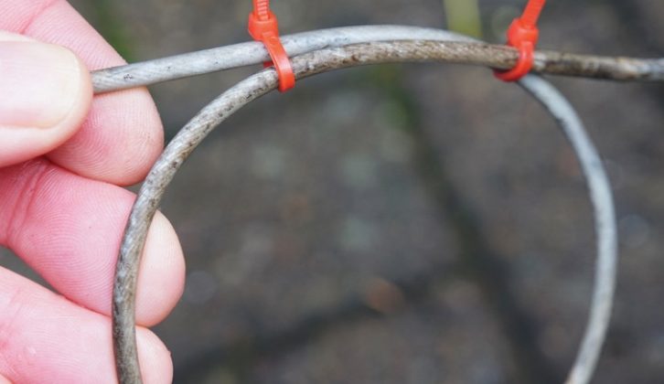 Shorten the cable by forming a loop and fixing with twin small cable ties