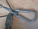 Slide on the new carabiner and stabilise with crossed cable ties, if you wish