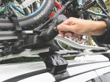 Frame-holding racks offer more security - an arm attaches to the bike frame, straps secure the wheels