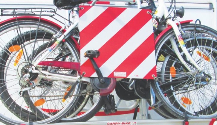 Some countries require you to display this warning sign on protruding loads, such as bikes