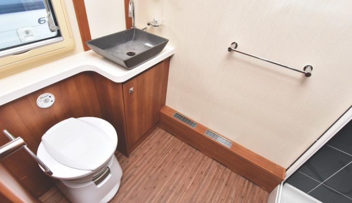 The rear washroom has electric flush Dometic toilet and the smart shower cubicle is of domestic size and finish
