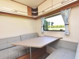 The rear dinette turns into a large single bed and has a fold-out bunk above