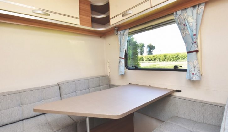 The rear dinette turns into a large single bed and has a fold-out bunk above