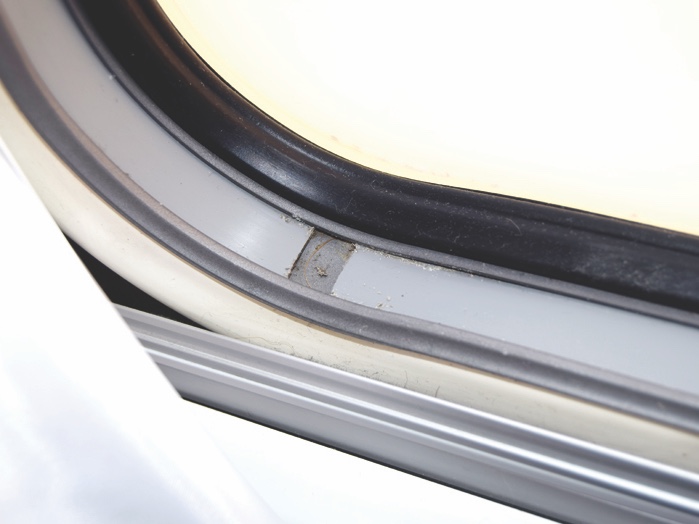 A split in this PVC strip has rendered the left-hand window catch inoperative