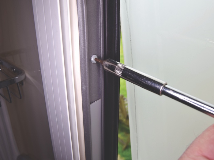 Remove the end-stop screen from the left-hand side of the window frame