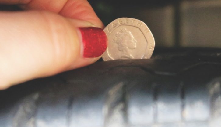 To check the depth, place a 20p coin into the main tread groove. If the outer band on the coin is obscured when inserted, the tread is within legal limit