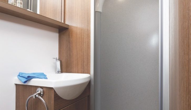 The shower cubicle at the far end of the washroom is a good height and width, with an Ecocamel shower head