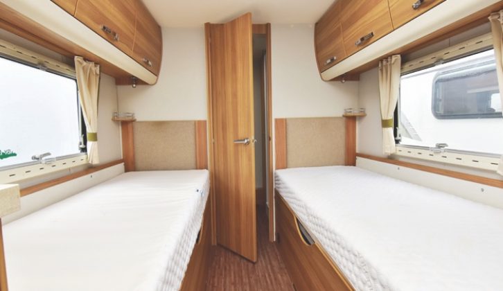 The twin fixed beds are fitted with Ozio mattresses and storage beneath