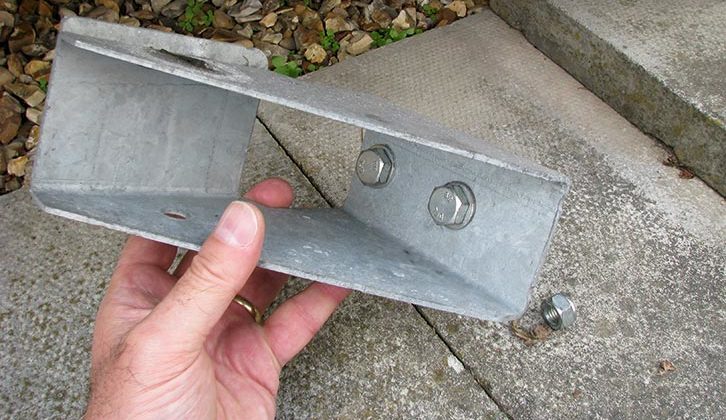 Position the inner jack mounting bracket over the pre-punched holes, or insert the bolts (and washers) through the holes in the bracket