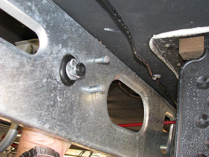 With bracket inside the chassis, feed the bolts through the holes