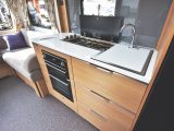 Large drawers, three-burner hob, oven/grill and microwave in kitchen