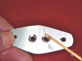 6. Countersink the two holes as shown and then apply epoxy adhesive to the surfaces. Insert two M4 x 6 countersunk stainless steel screws and allow to set