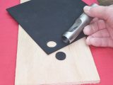 11. Use a 20mm washer punch to cut out a disc from the nitrile rubber sheet