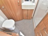 The washroom is luxurious, with a large handbasin, domestic-style shower cubicle and a mirror with integral LED lighting