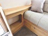 Opposite the sofa is a TV shelf with a cubby hole below - there's no window here, though