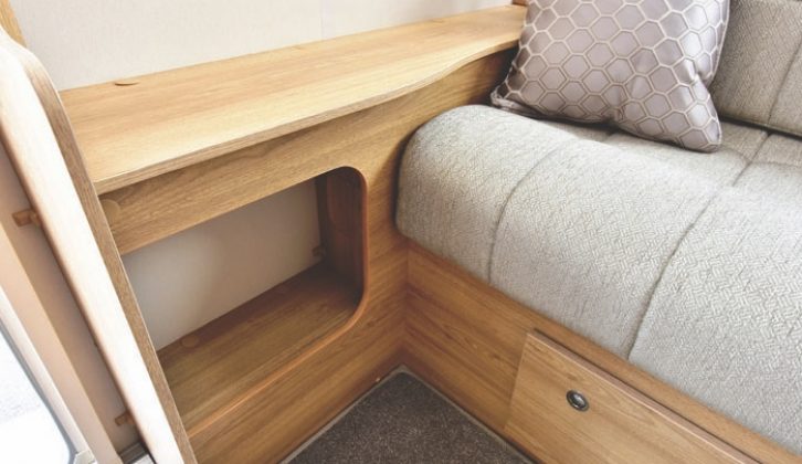 Opposite the sofa is a TV shelf with a cubby hole below - there's no window here, though