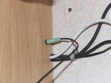 Plug in audio lead between locker's socket and radio