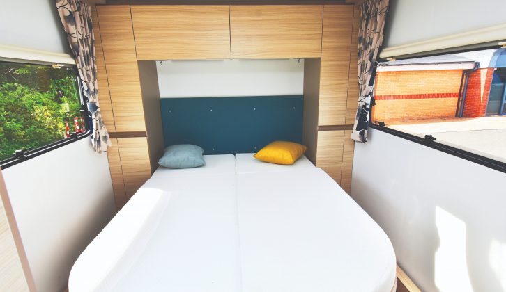 The fixed island bed can be closed off at night with a solid partition