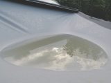Gently release water that pools on the roof to avoid stretching the material