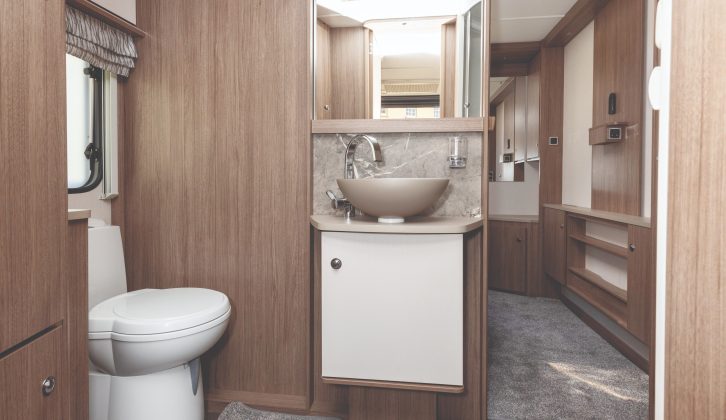 Storage in the washroom is excellent, with a large cupboard below the handbasin and a double cupboard over the window