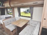 The side single dinette is sizeable enough for two adults at meal-times, and also makes up into a third bed if needed