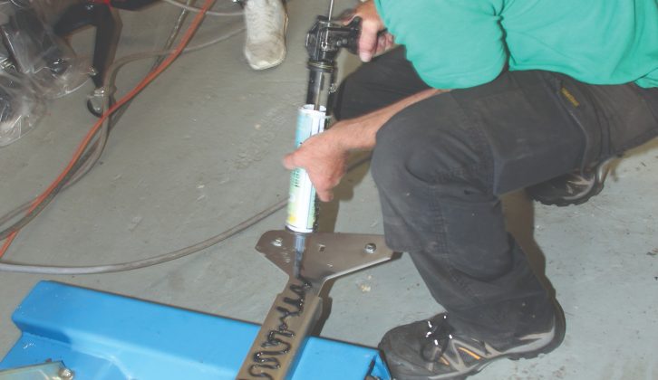 Adhesive is applied to the new steady baseplates